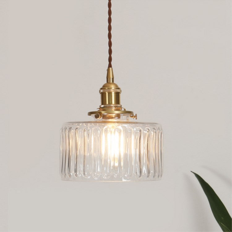 Round patterned glass pendant light with brass fitting and twisted cord