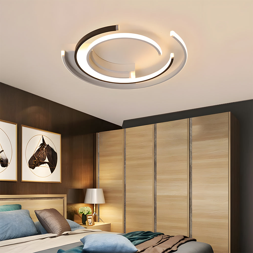 Black circular LED flush mount ceiling light with layered rings