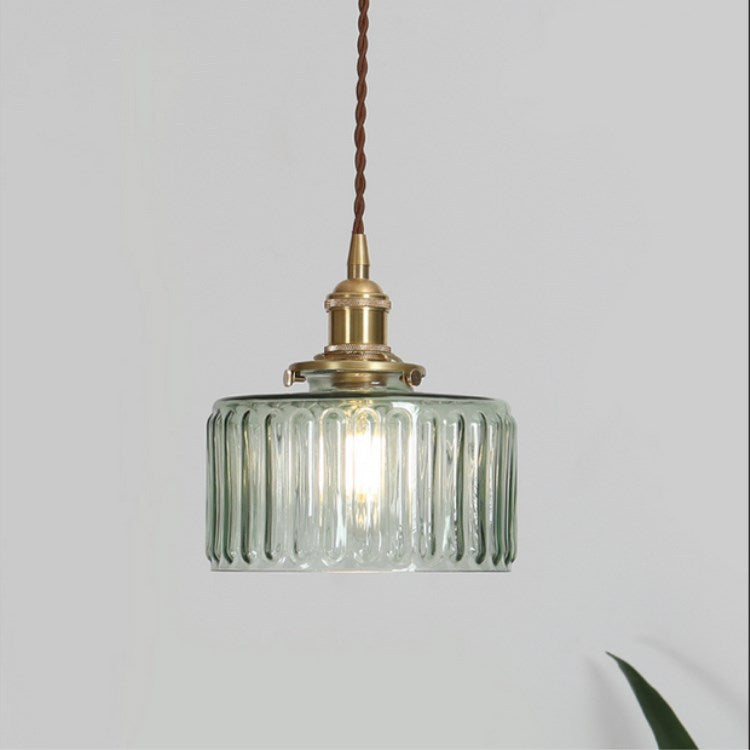Round patterned glass pendant light with brass fitting and twisted cord