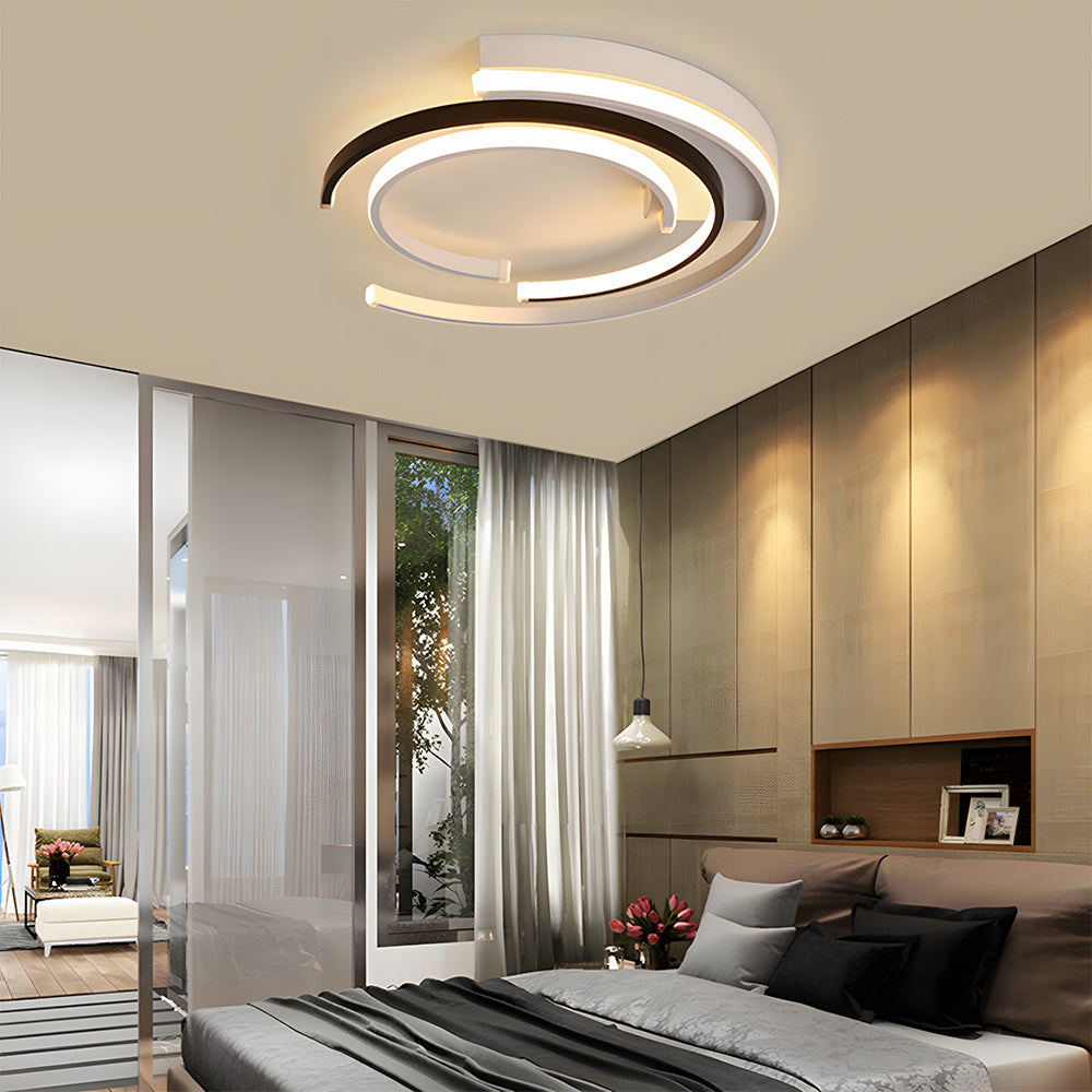 Black circular LED flush mount ceiling light with layered rings