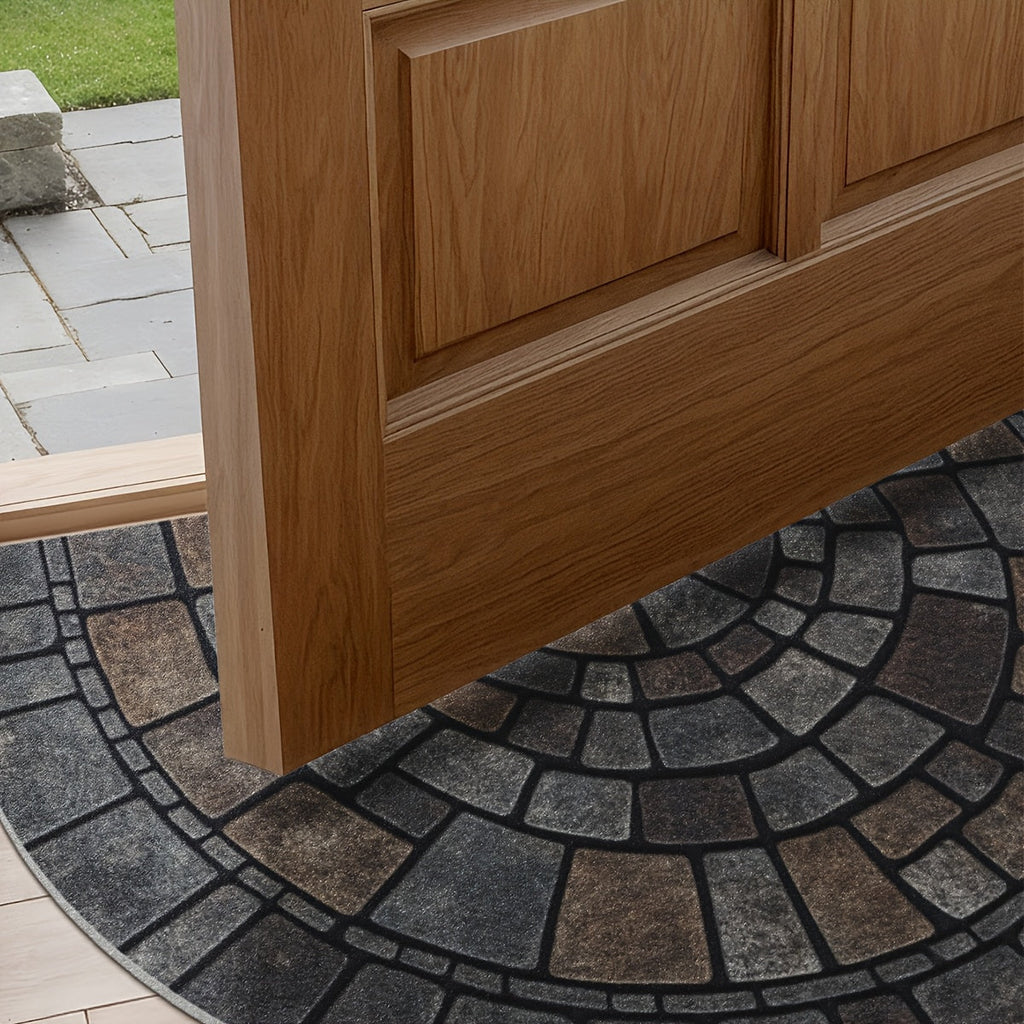 Half-circle gray geometric mosaic door mat at an entryway