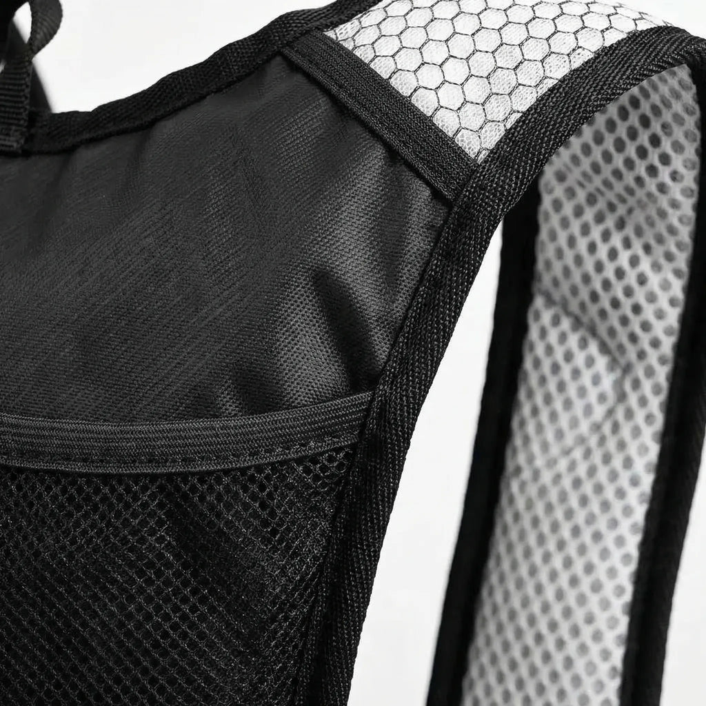 Black hydration backpack with translucent water bladder and blue drinking tube