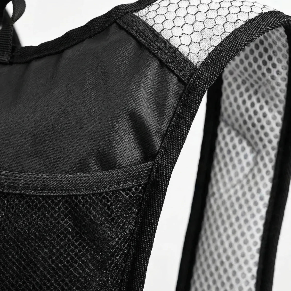 Black hydration backpack with translucent water bladder and blue drinking tube
