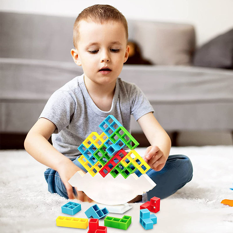 Colourful Tetris-style blocks arranged on a white balancing stand