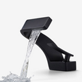 Curved bathroom basin faucet with waterfall-style spout and single lever