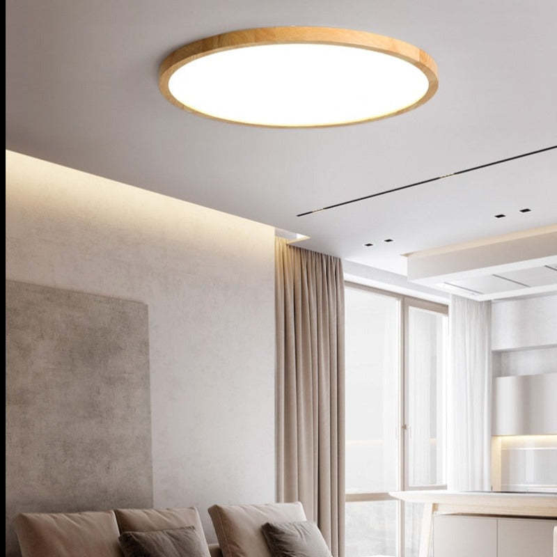 Round slim ceiling light with a natural wood-effect ring and white diffuser