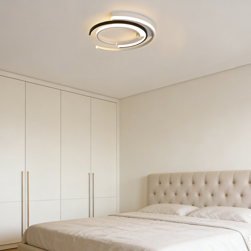 Black circular LED flush mount ceiling light with layered rings