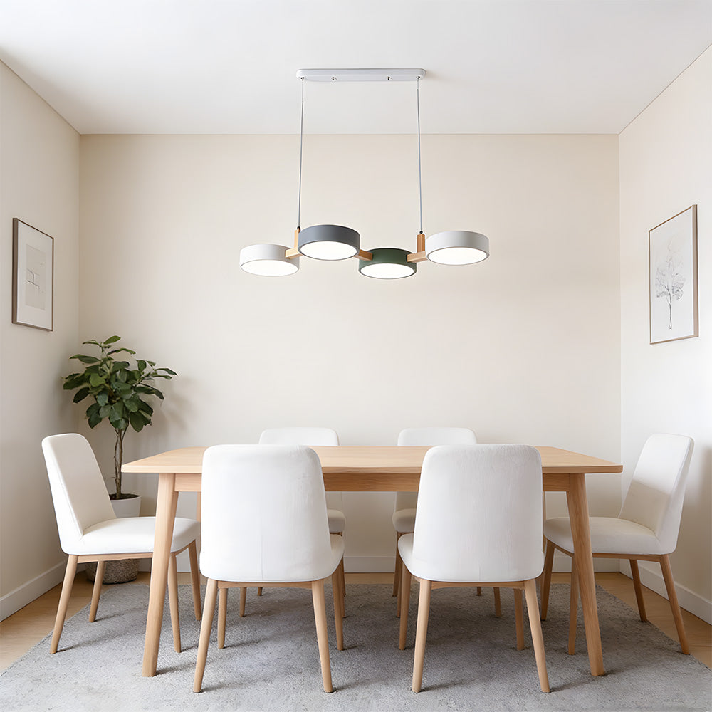 Four-shade suspended pendant light with circular shades and connecting bar