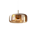 Rounded pendant light with translucent shade and hanging cord