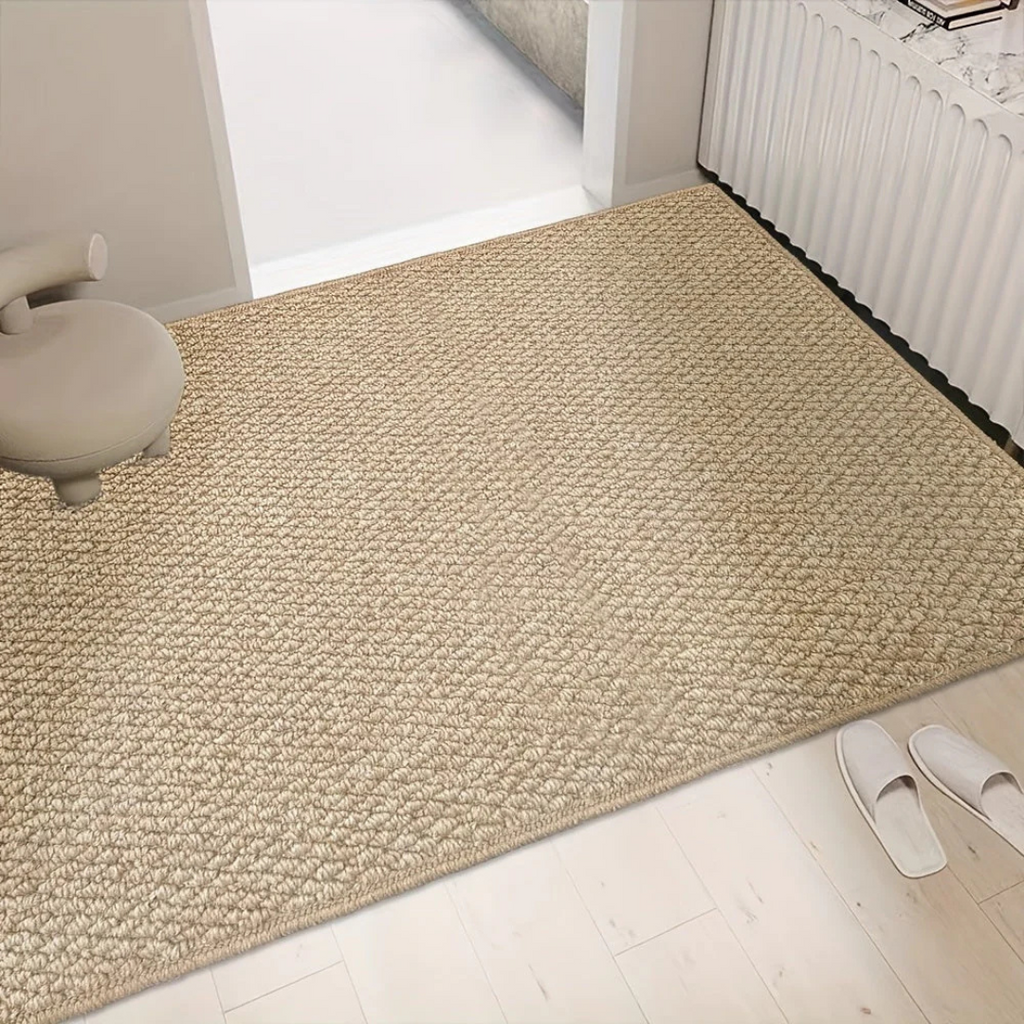 Beige rectangular textured indoor door mat with dark finished edge