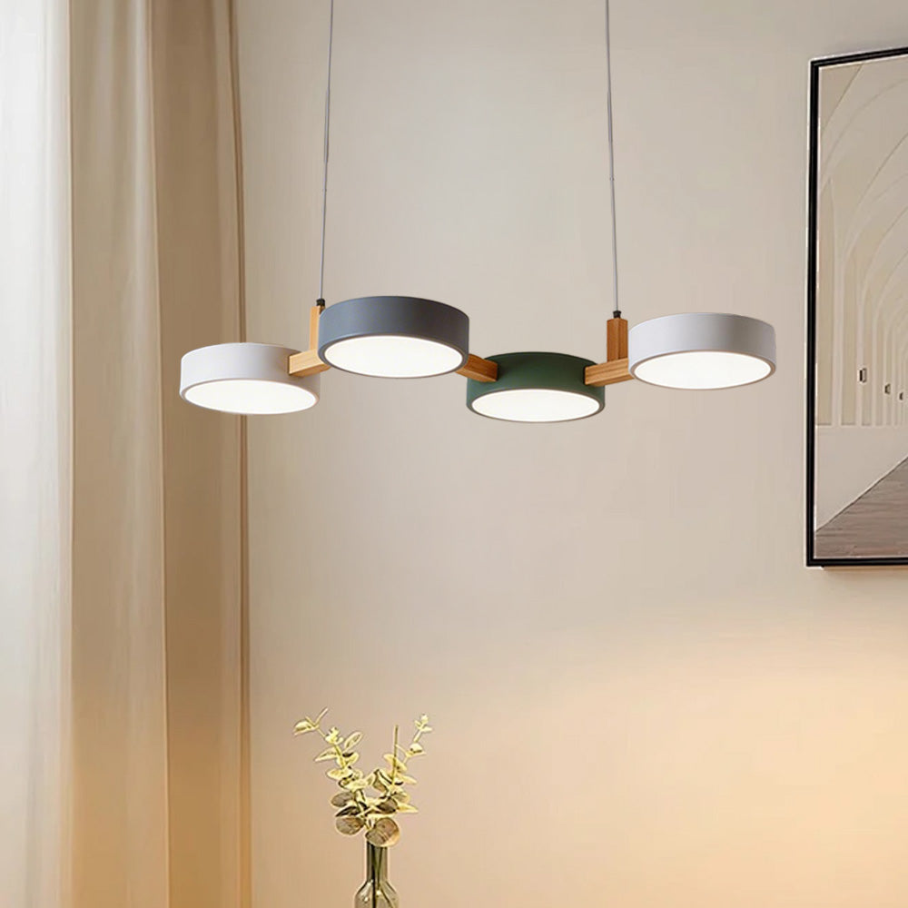 Four-shade suspended pendant light with circular shades and connecting bar