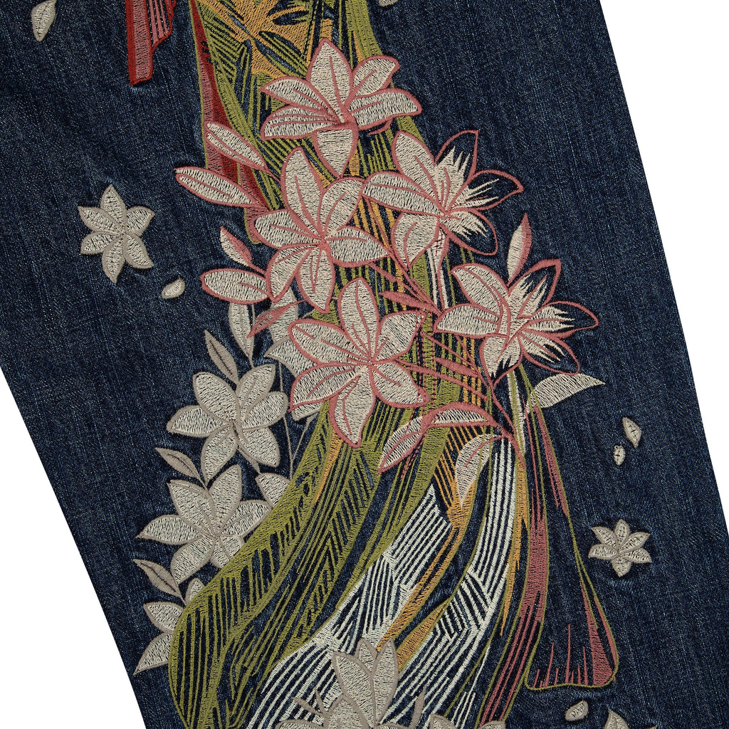 Indigo blue straight leg jeans with floral and Japanese-inspired back embroidery