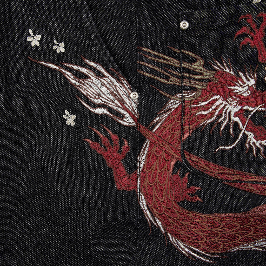 Black raw denim jeans with red and white dragon graphics