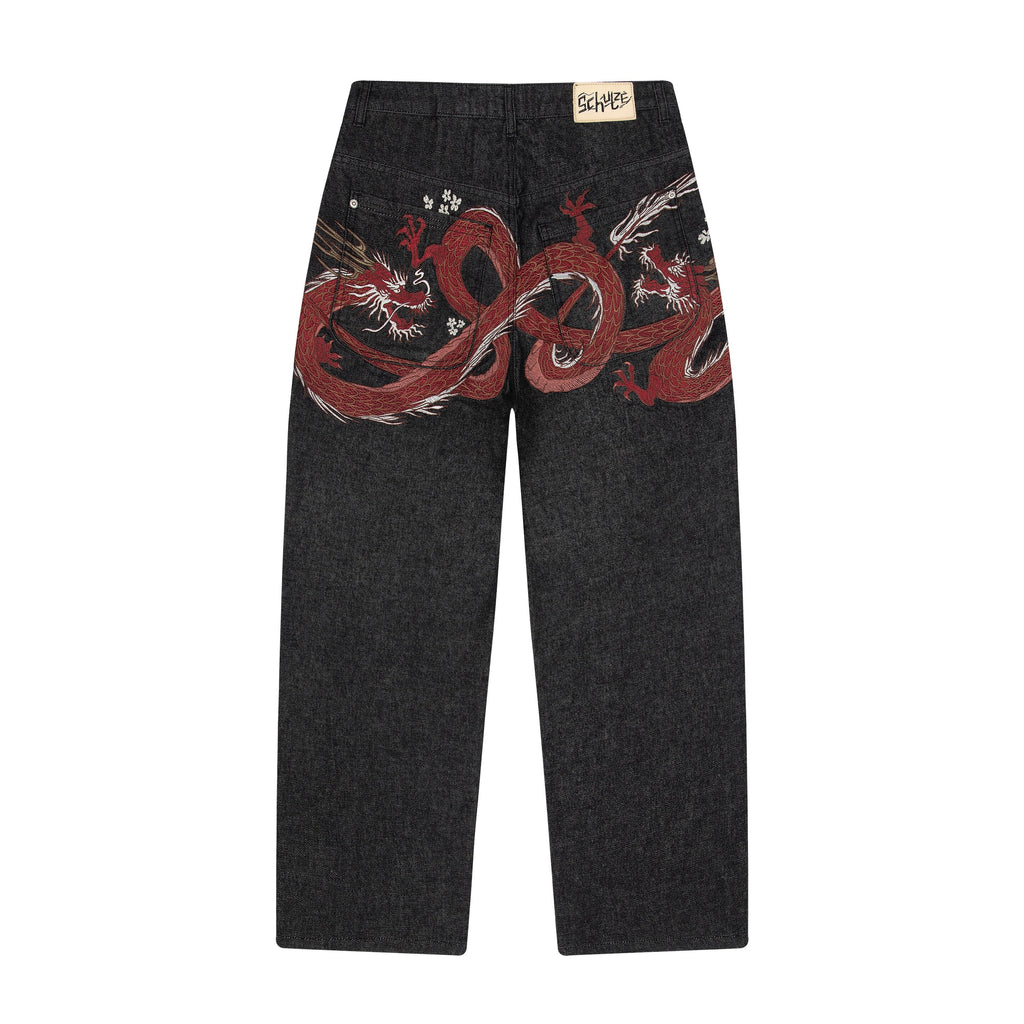 Black raw denim jeans with red and white dragon graphics