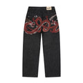 Black raw denim jeans with red and white dragon graphics