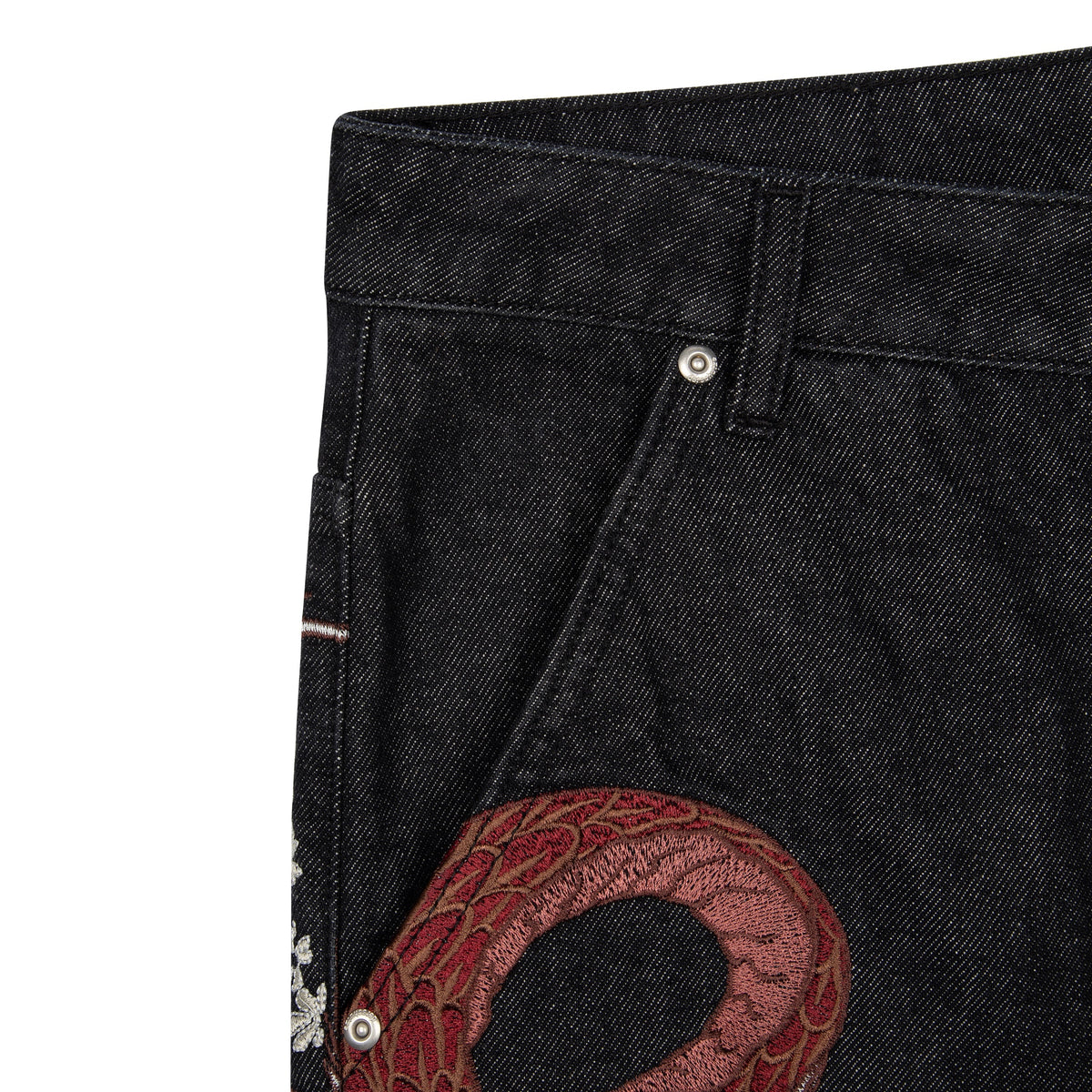 Black raw denim jeans with red and white dragon graphics
