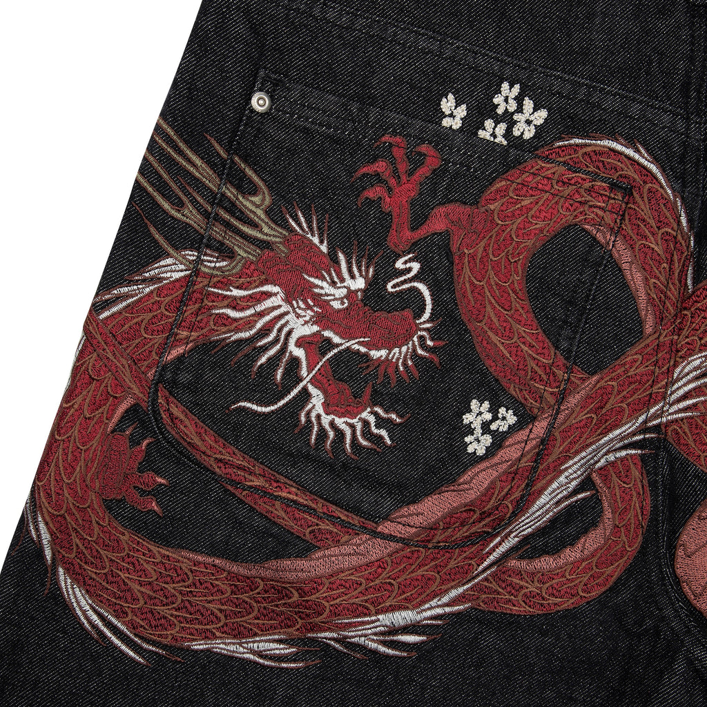 Black raw denim jeans with red and white dragon graphics