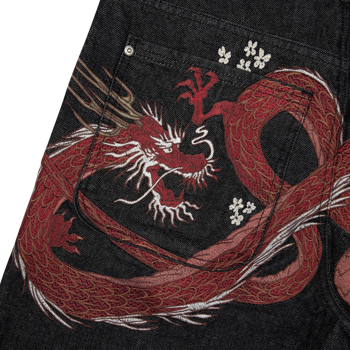 Black raw denim jeans with red and white dragon graphics