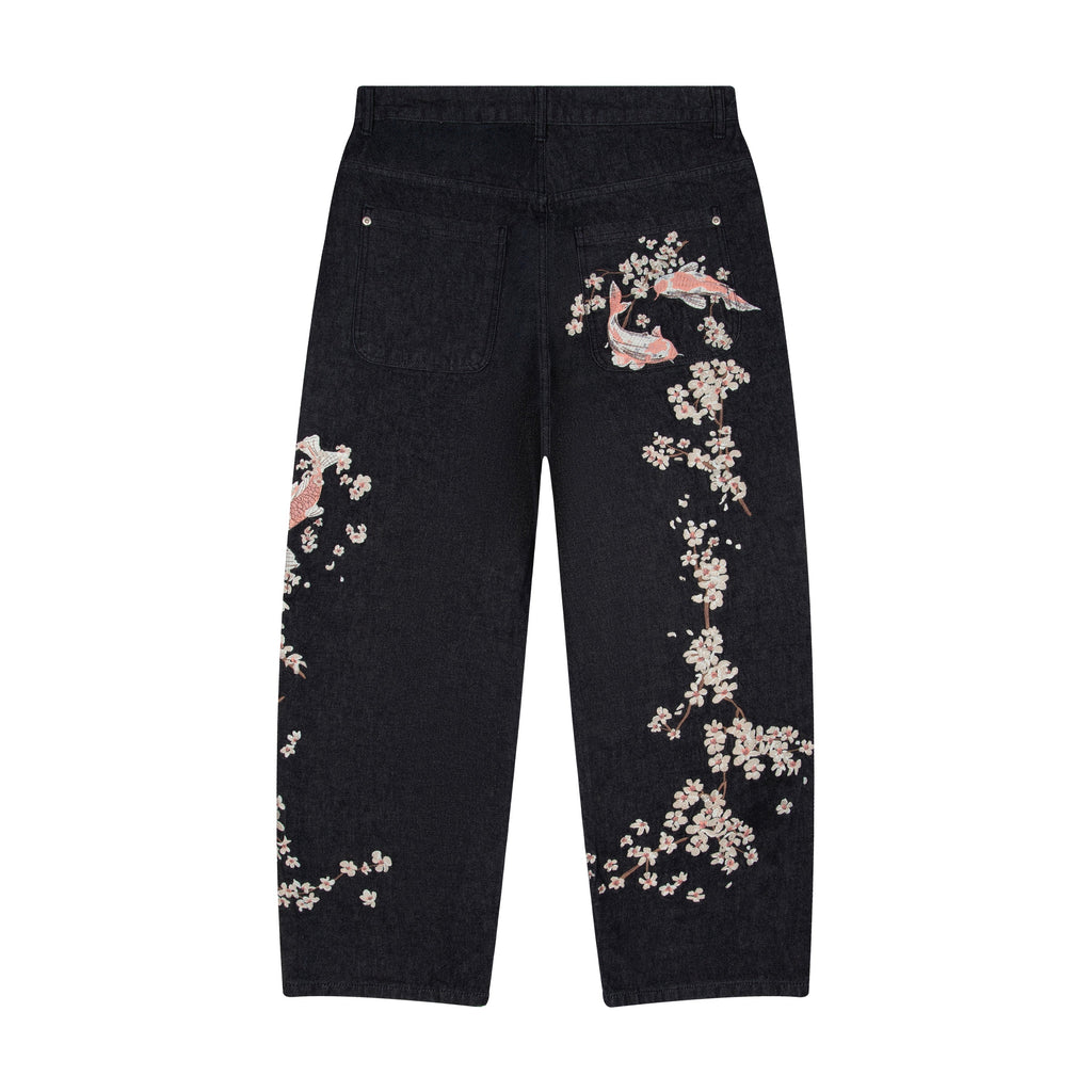 Black denim jeans with floral koi embroidery and straight legs