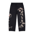 Black denim jeans with floral koi embroidery and straight legs