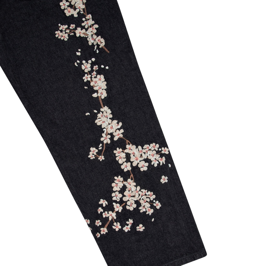 Black denim jeans with floral koi embroidery and straight legs