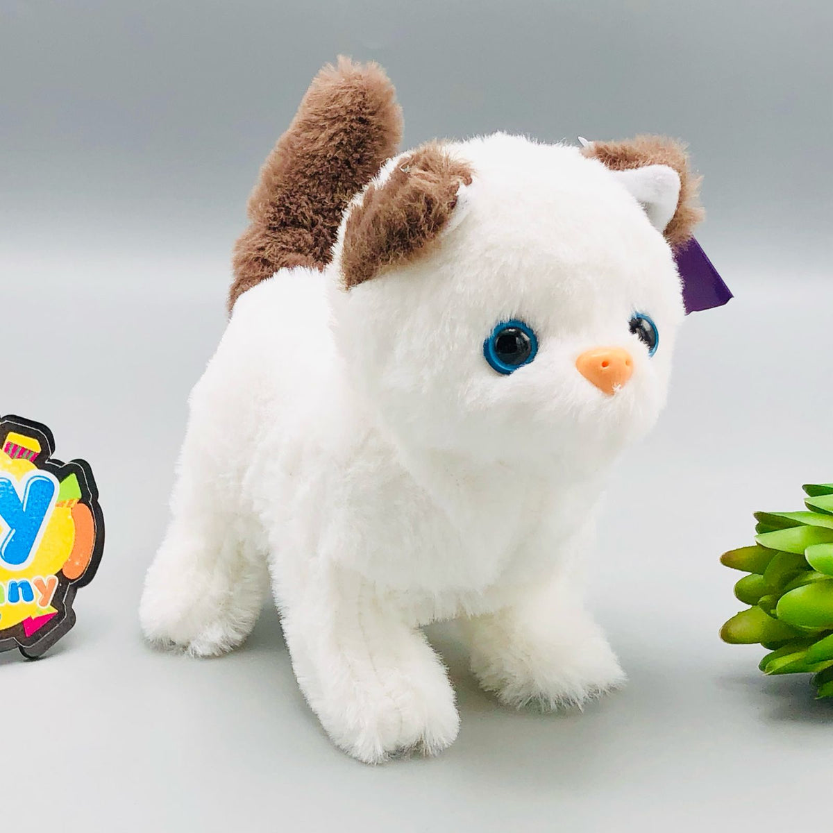 Walking plush cat toy with sound in white and orange striped designs
