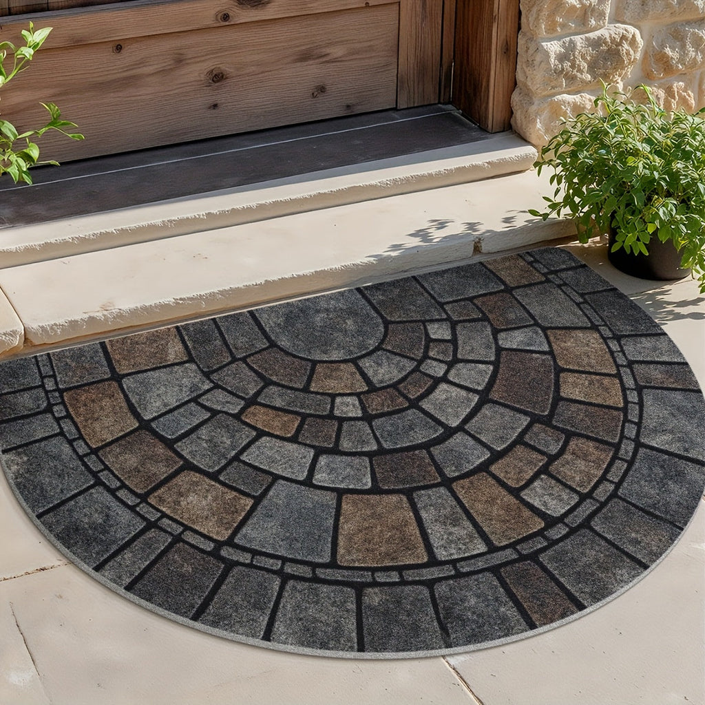Half-circle gray geometric mosaic door mat at an entryway