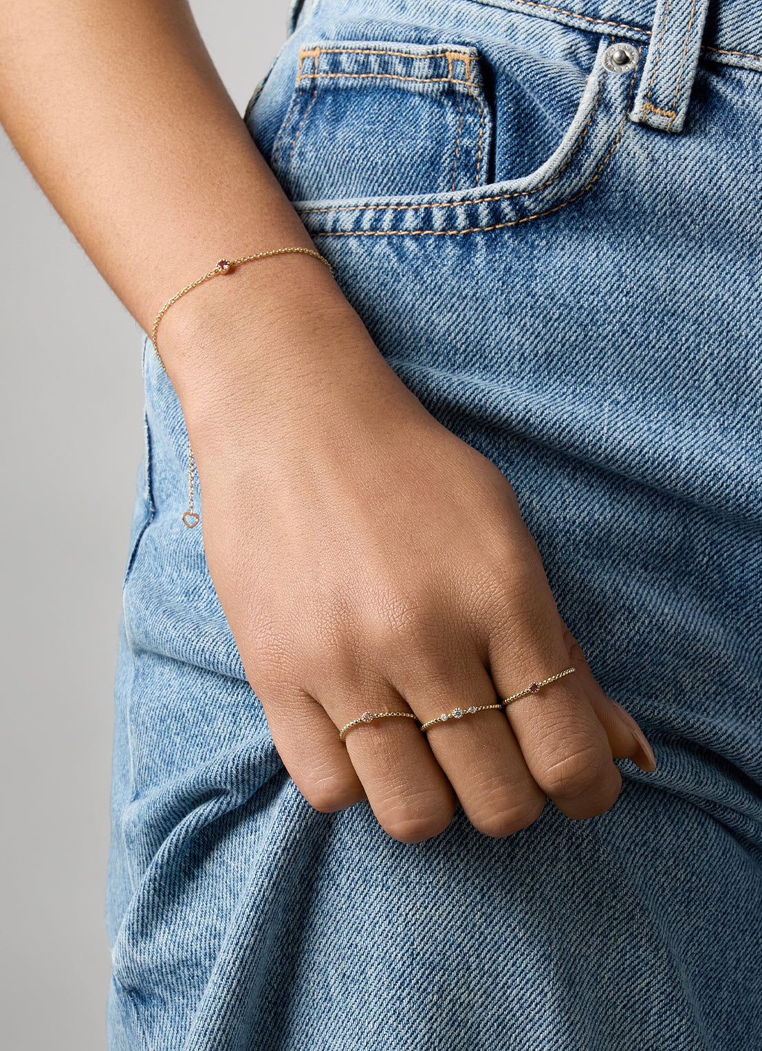 Yellow gold ring with beaded band and three diamond-set accents