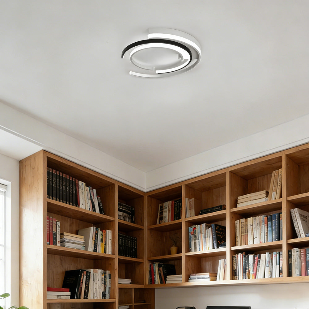 Black circular LED flush mount ceiling light with layered rings