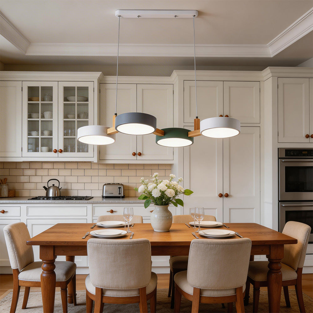 Four-shade suspended pendant light with circular shades and connecting bar