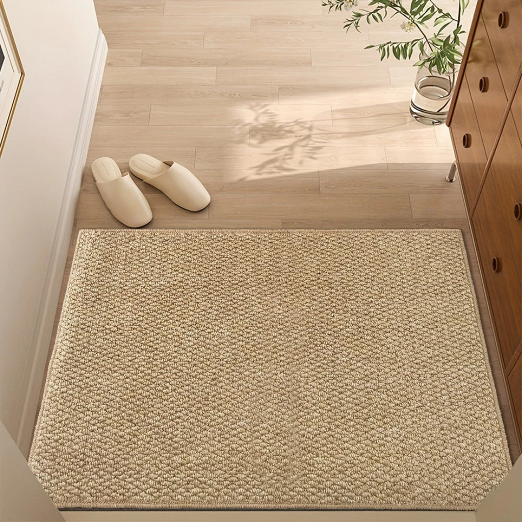 Beige rectangular textured indoor door mat with dark finished edge
