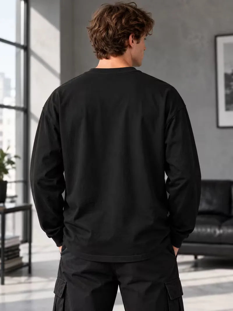 Long sleeve crew neck top with contrasting graphic prints on the sleeves