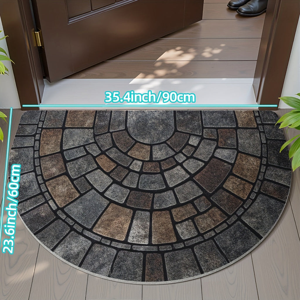 Half-circle gray geometric mosaic door mat at an entryway