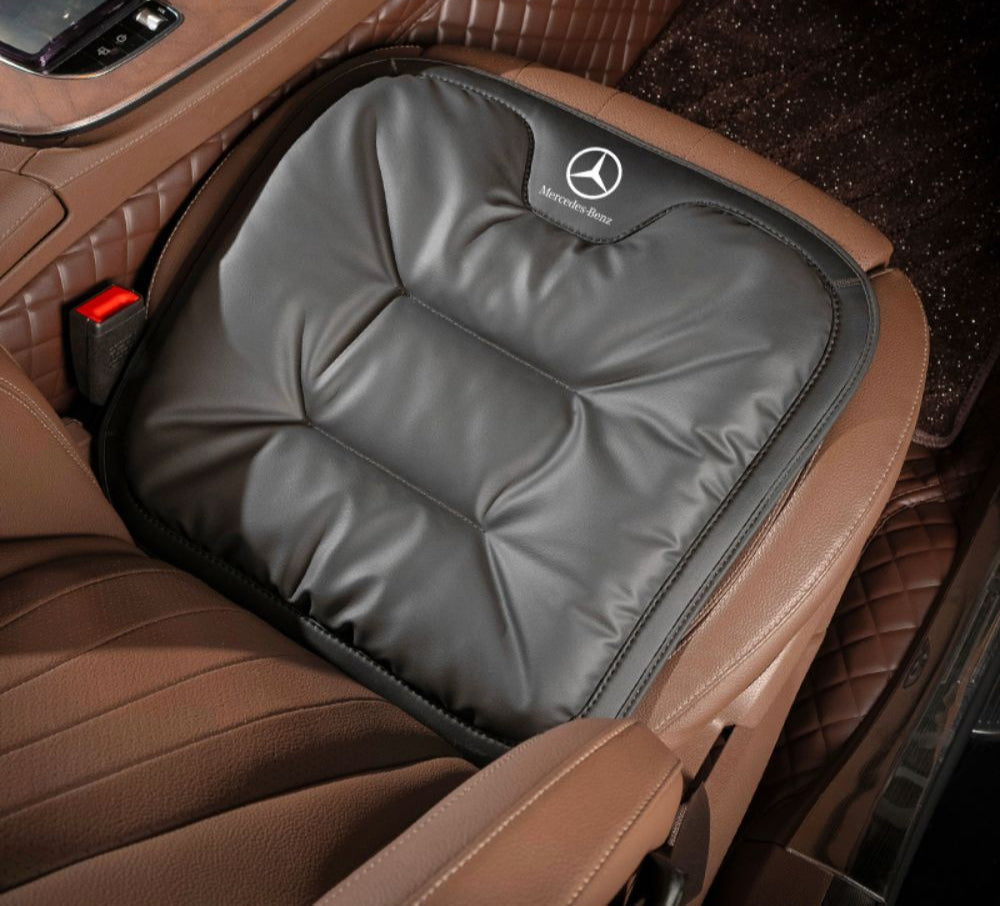 Quilted padded car seat cushion placed on a vehicle seat