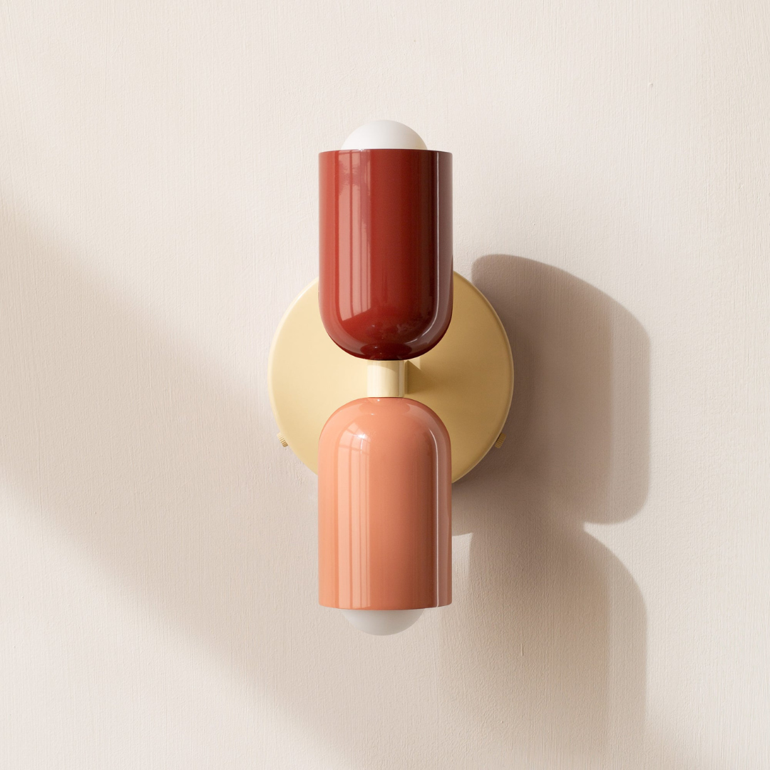 Two light cylindrical LED wall sconce with round wall plate