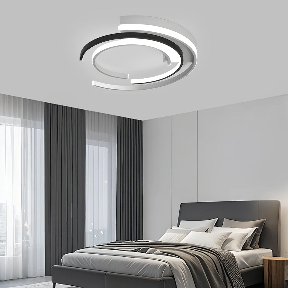 Black circular LED flush mount ceiling light with layered rings