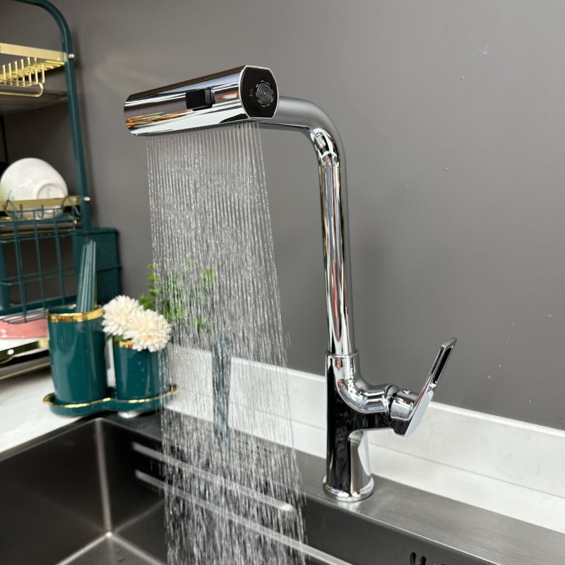 Chrome kitchen faucet attachment with flexible spray head over a sink