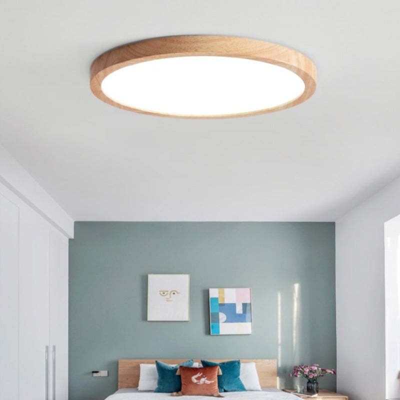 Round slim ceiling light with a natural wood-effect ring and white diffuser