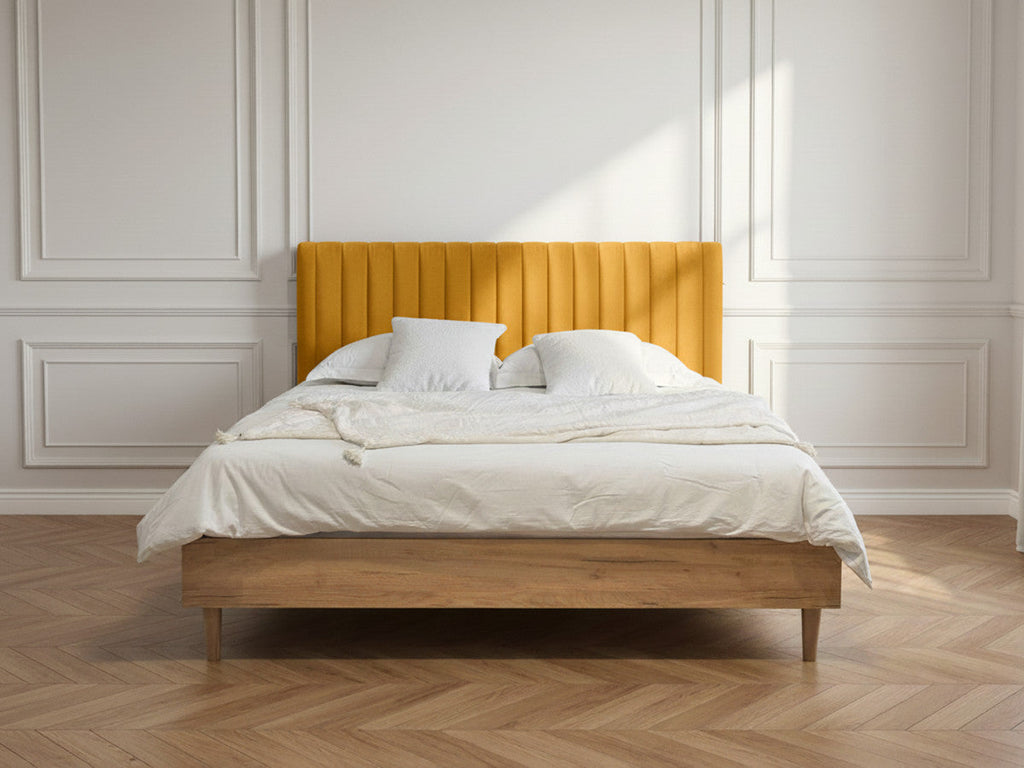 Upholstered bed frame with vertically channelled headboard