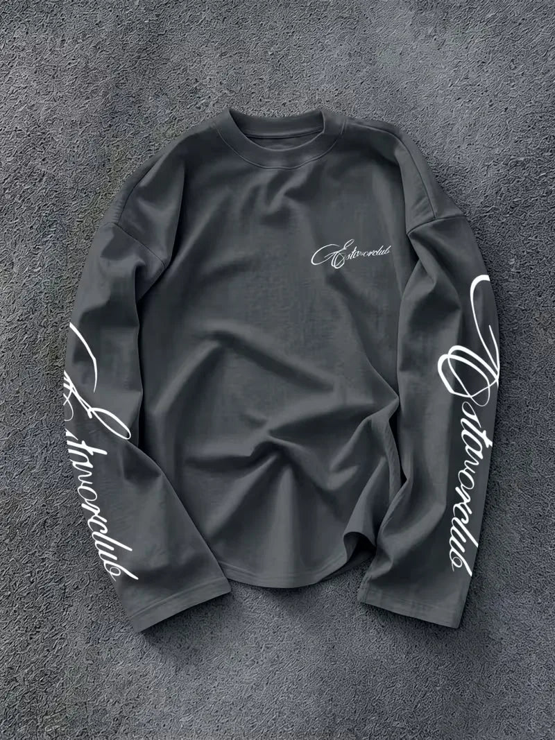 Long sleeve crew neck top with white script lettering on the sleeves