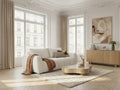 Three-seater upholstered sofa bed with rounded arms in a living room