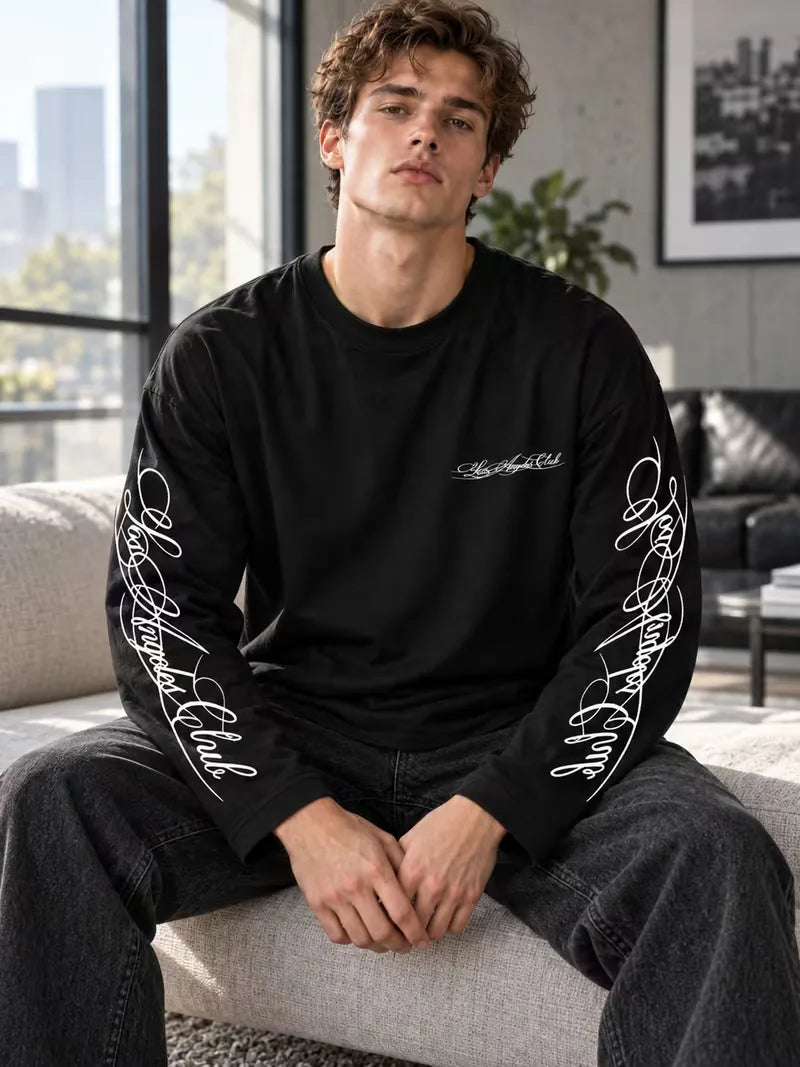 Long sleeve crew neck top with contrasting graphic prints on the sleeves