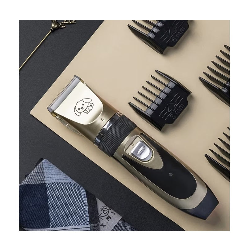 Black and gold cordless pet hair clipper with four guide combs and grooming accessories