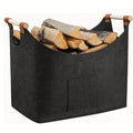 Black felt firewood basket with wooden handles and front pocket