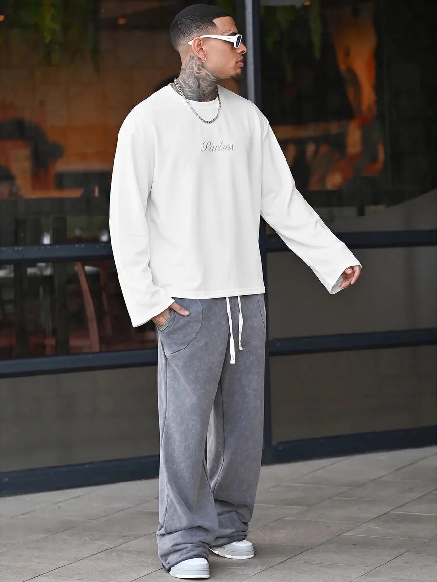 Oversized long sleeve shirt with graphic slogan design