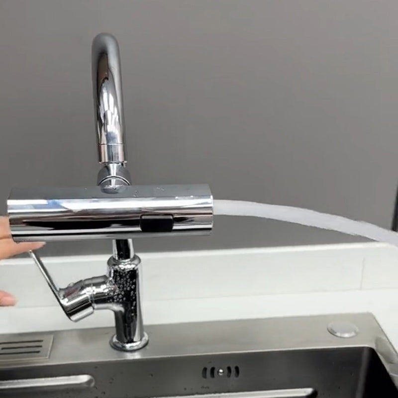 Chrome kitchen faucet attachment with flexible spray head over a sink