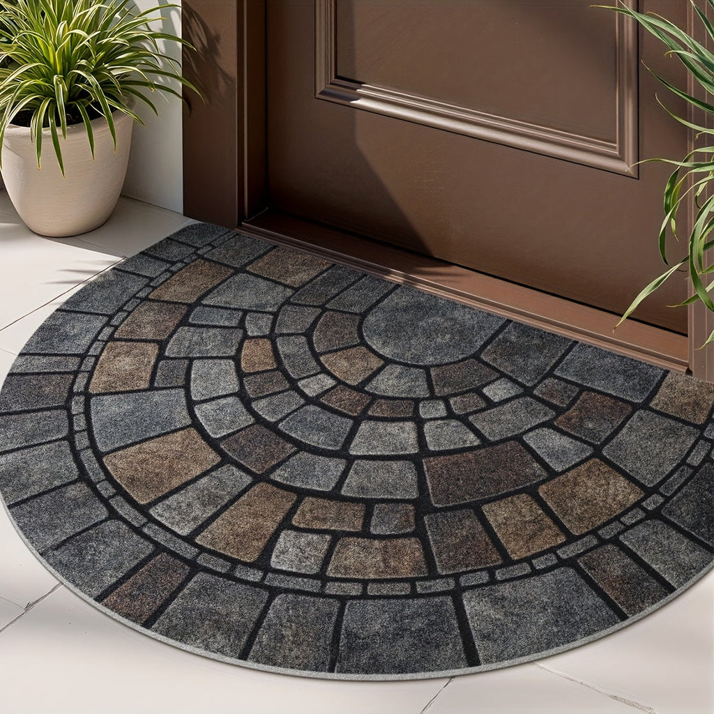 Half-circle gray geometric mosaic door mat at an entryway