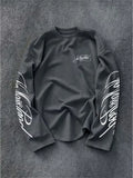 Long sleeve top with printed text on the chest and sleeves