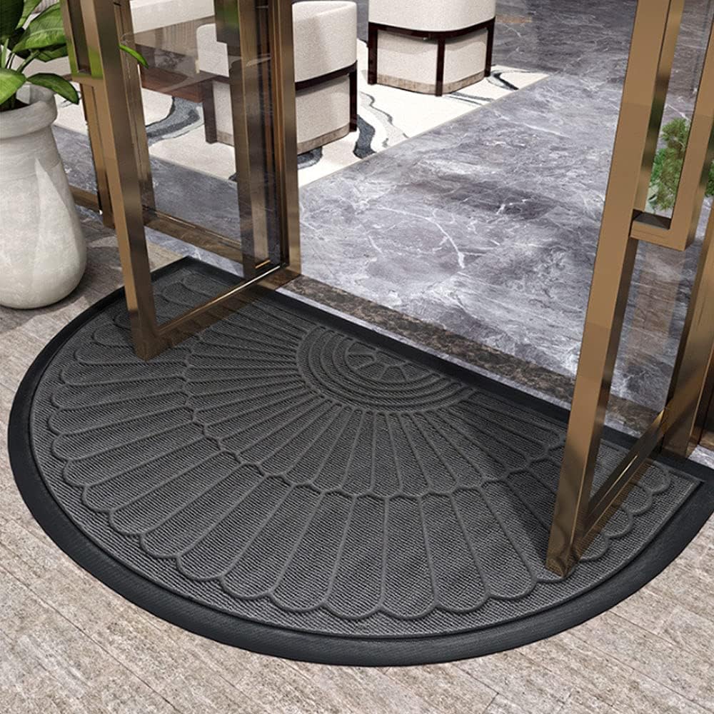 Semi-circular textured rubber door mat with raised fan pattern