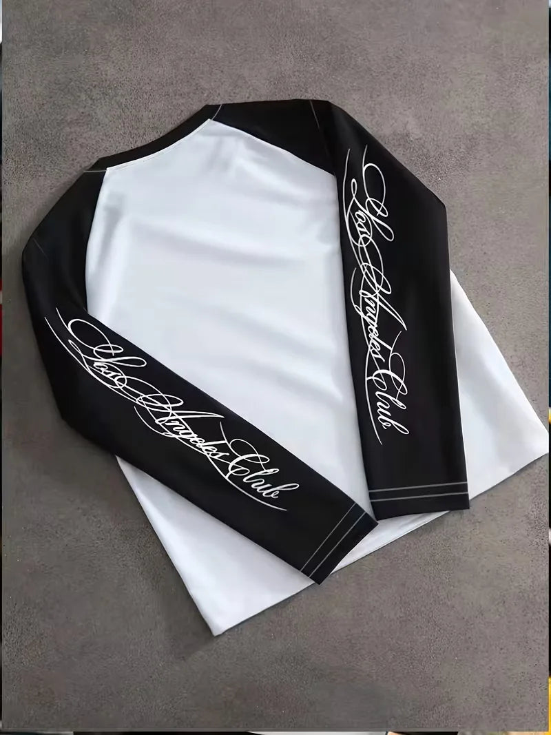 Black and white long sleeve colour block shirt with graphic sleeve prints